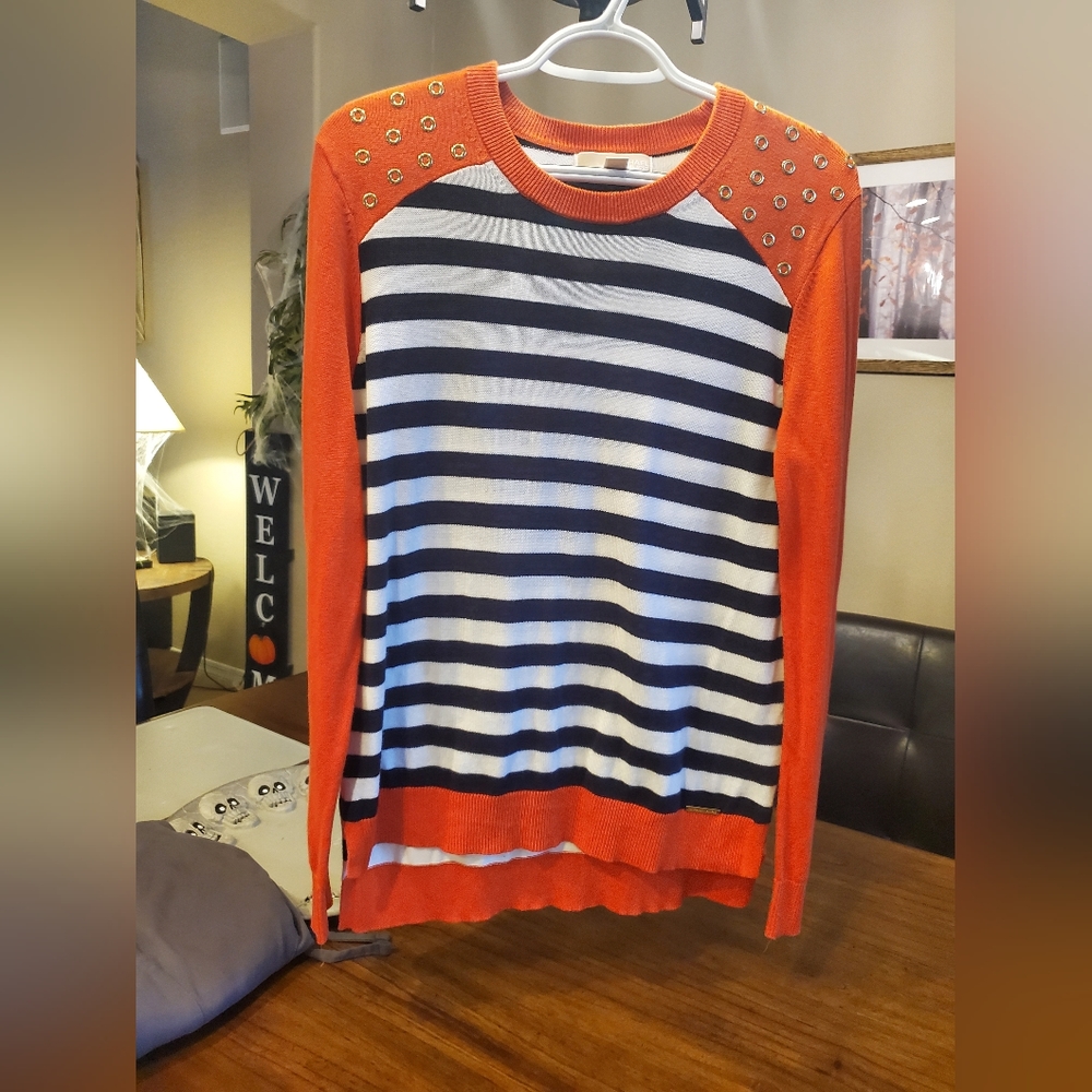 Michael Kors sweater. Size L. Orange, navy, white with gold circle accents.